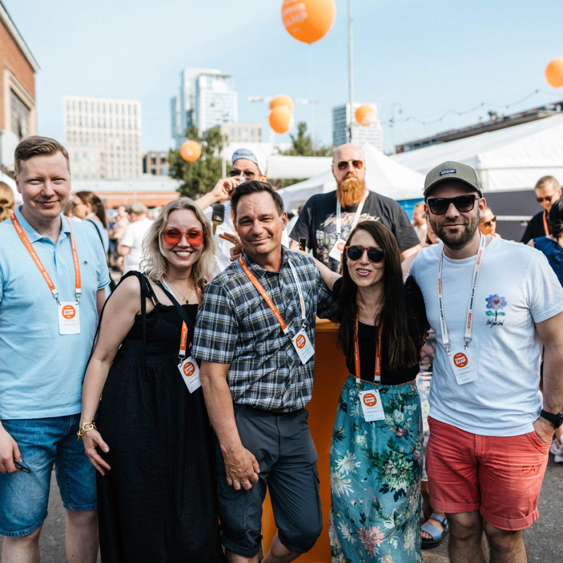 Team of colleagues gathering at summer party